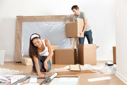 A moving team handling boxes during a Westminster removals process