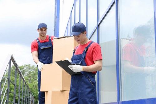 Removal team sorting cardboard and reusable items during a sustainable Westminster move