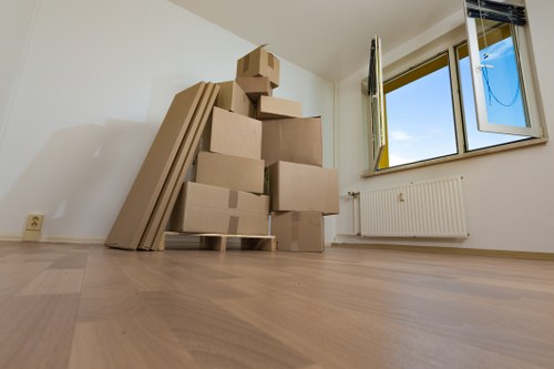 Packed office boxes and furniture ready for relocation in Westminster