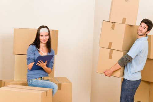 Moving crew managing furniture in a property during a service